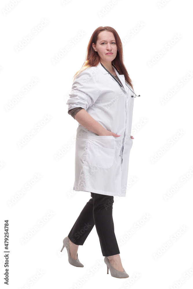 mature woman doctor striding forward. isolated on a white background. mature woman doctor striding forward. isolated on a white background.