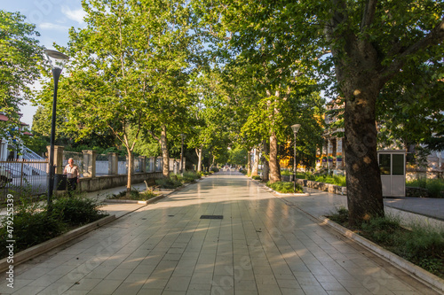 MOSTAR, BOSNIA AND HERZEGOVINA - JUNE 10, 2019: Tree lined pedestrian street in Mostar, Bosnia and Herzegovina