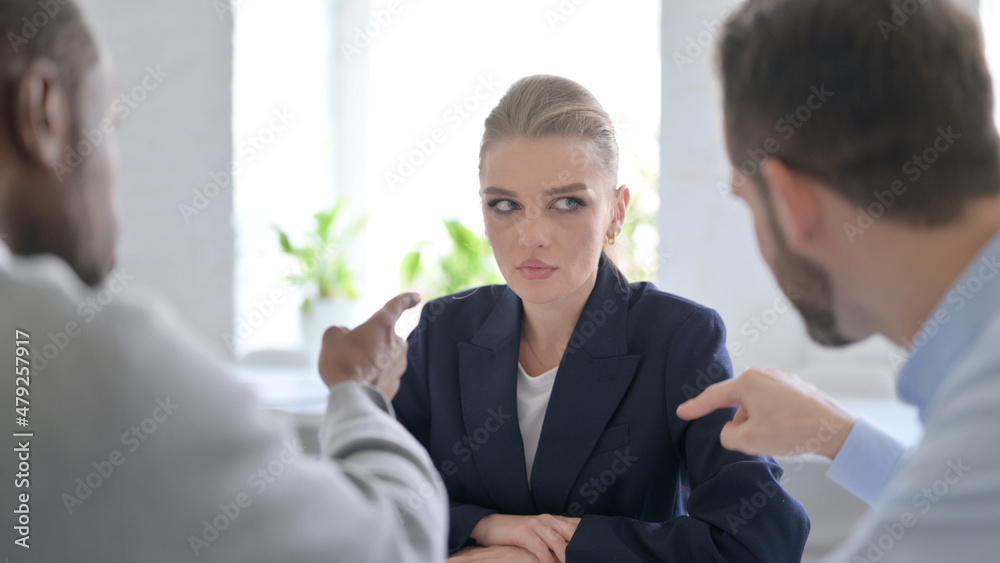 Angry Male Business People Scolding Young Businesswoman Angry Male Business People Scolding Young Businesswoman