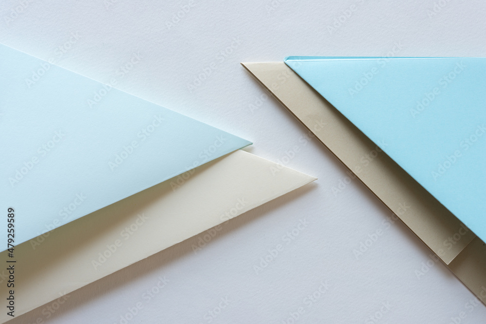 folded paper- blue and beige folded paper- blue and beige