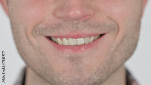 Close up of Smiling Lips of Young Man