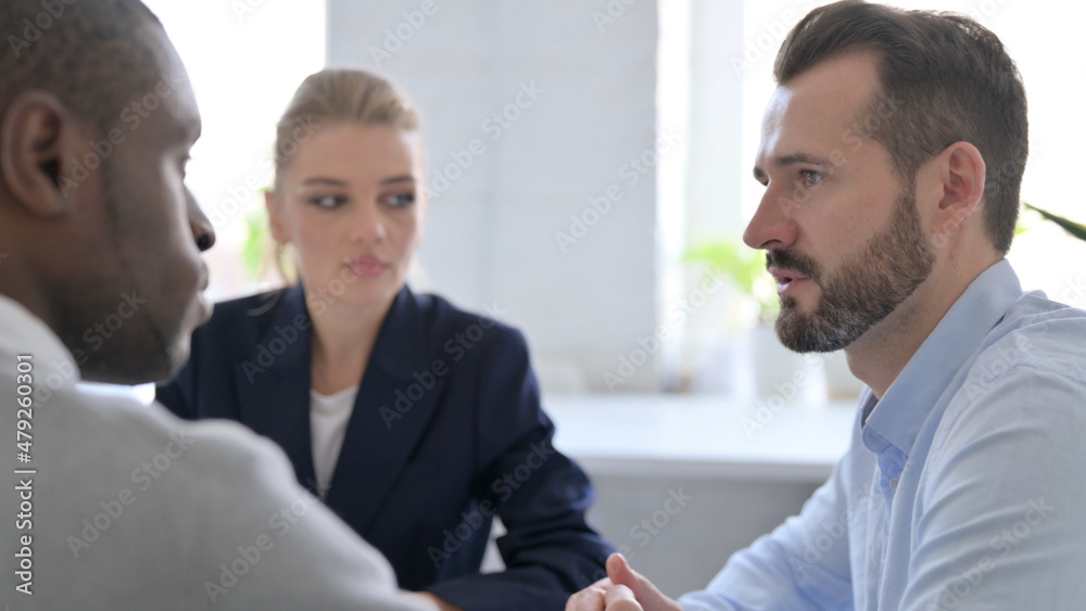 Close up of Businessman Talking to Business People Close up of Businessman Talking to Business People