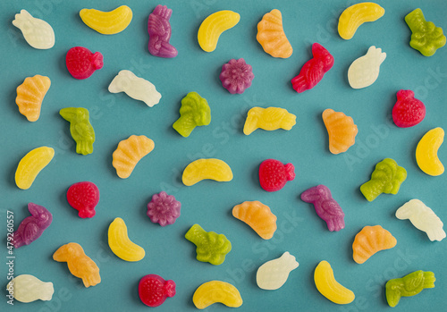 Jelly candies in shape of fruits, trees and birds as pattern