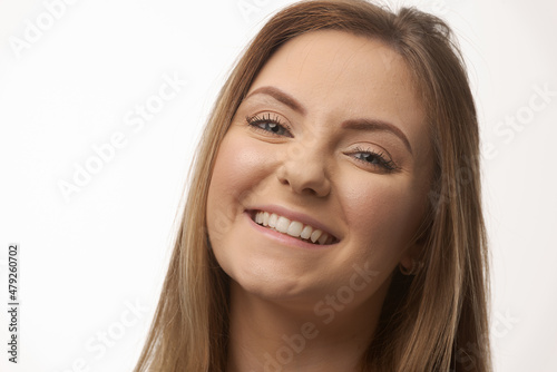 Young blonde woman isolated in studio portrait