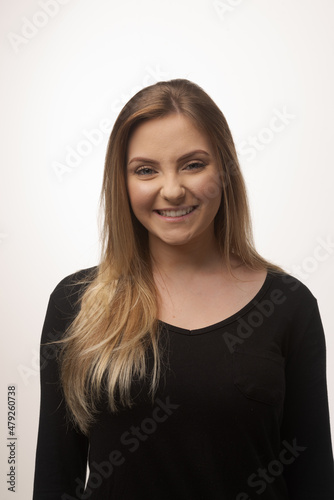 Young blonde woman isolated in studio portrait © Gustavo