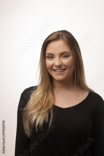 Young blonde woman isolated in studio portrait © Gustavo