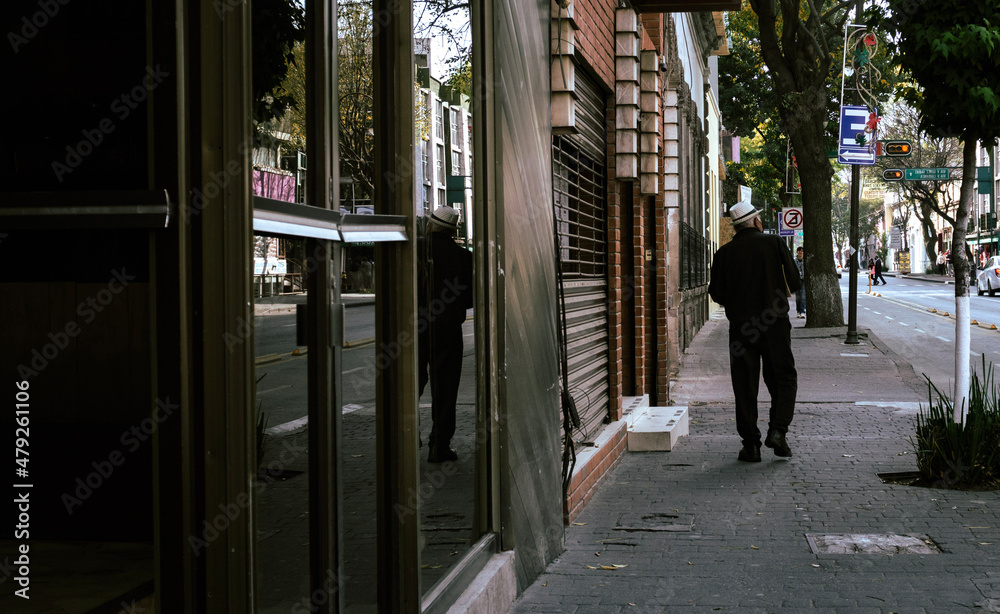 Fototapeta premium people walking on the street