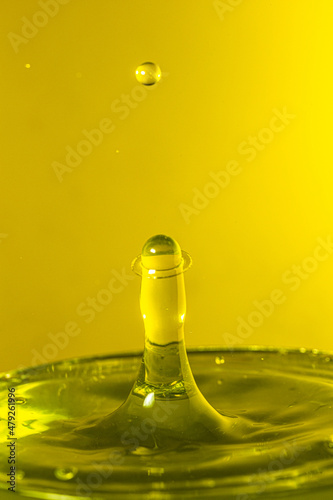 splash photography with yellow liquid