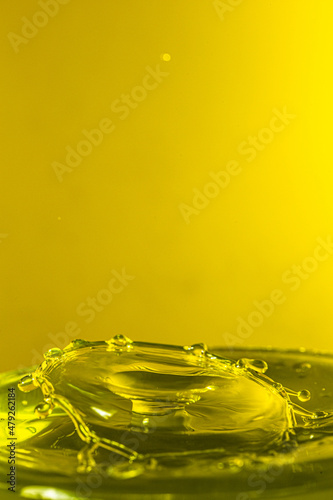 splash photography with yellow liquid