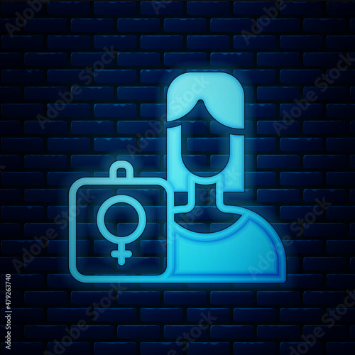 Glowing neon Female movement, feminist activist with banner and placards icon isolated on brick wall background. Feminist rights movement, feminism sisterhood. Vector