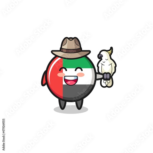 uae flag zookeeper mascot with a parrot