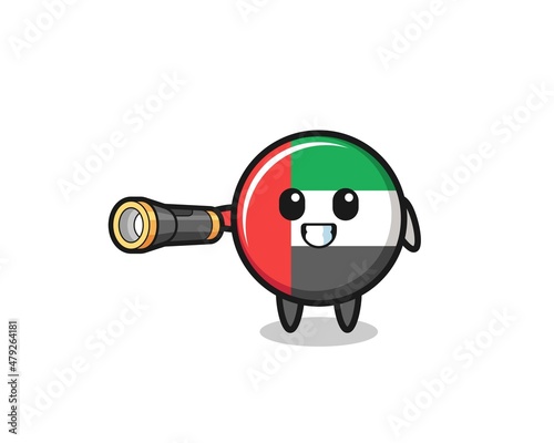 uae flag mascot holding flashlight