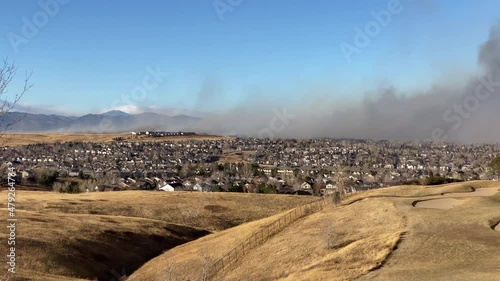 Smoke From Wildfire Above Residential Neighborhood. Marshall Fire, Boulder Area, Colorado USA, Late December 2021 photo