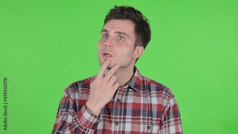 Portrait of Pensive Young Man Thinking New Plan, Green Chroma Screen Portrait of Pensive Young Man Thinking New Plan, Green Chroma Screen
