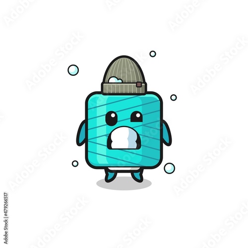cute cartoon yarn spool with shivering expression