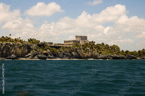 View of the Ancient Mayan ruins in Tulum Mexico from boat.