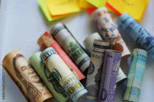 Rolled banknotes of different country