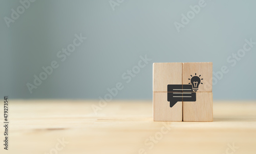 Business strategy from customer feedback and suggestion concept.  Customer centric. Team brainstrom and strategy planning. Wooden cube with feedback, idea, strategy symbols on grey backaground. Banner photo