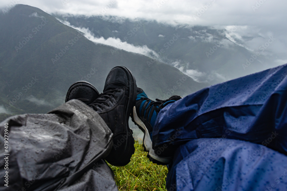 young couple hiker feet at the mountain top with dramatic sky at morning from flat angle young couple hiker feet at the mountain top with dramatic sky at morning from flat angle
