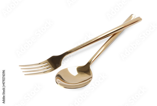 New shiny golden fork and spoon on white background