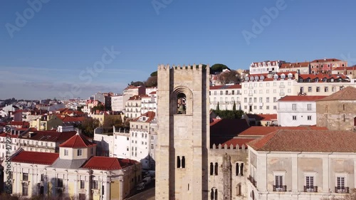 Close up approach to the bells of the Catedral Sé Patriarcal Igreja de Santa Maria Maior in Alfama Lisbon Portugal Europe on a blue skies winter day photo