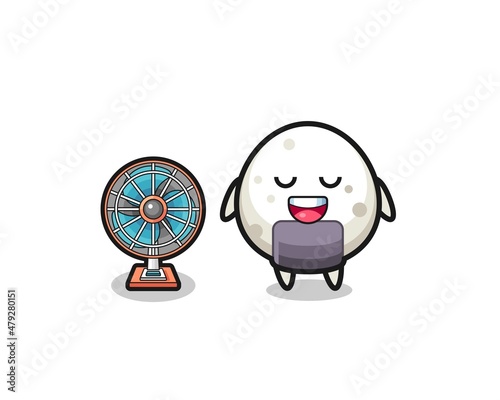 cute onigiri is standing in front of the fan