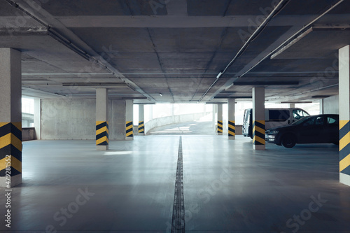 Open car parking garage with ramp on sunny day