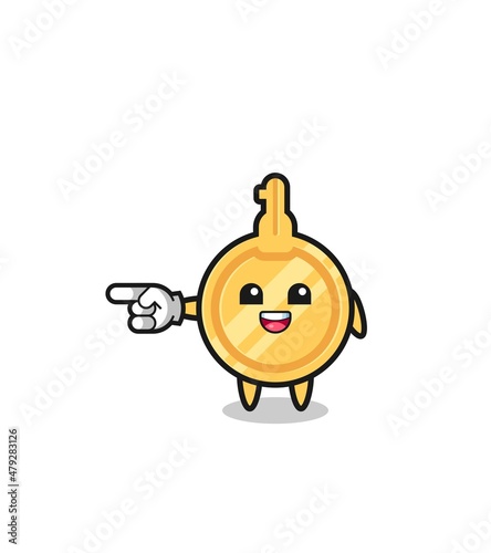 key cartoon with pointing left gesture