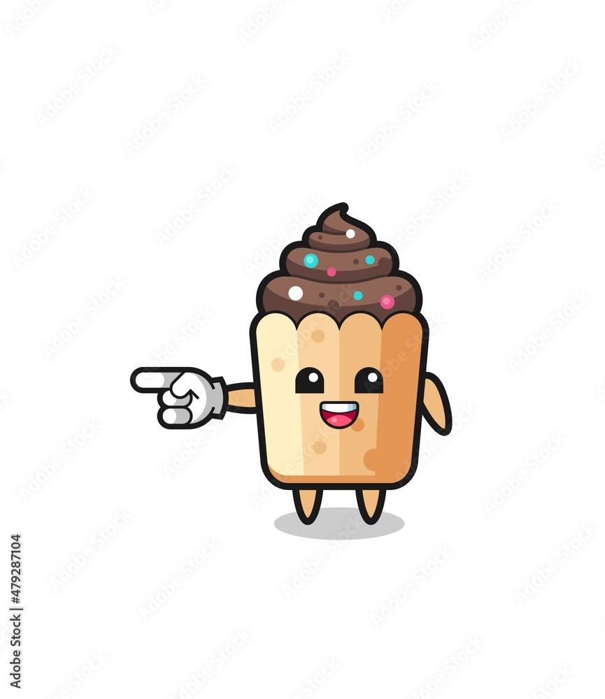 cupcake cartoon with pointing left gesture