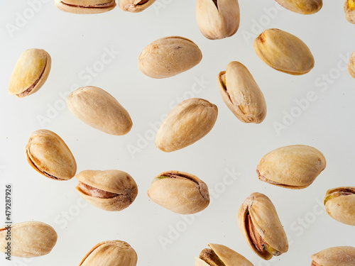 Pistachios isolated on a white background, top view. Flat lay