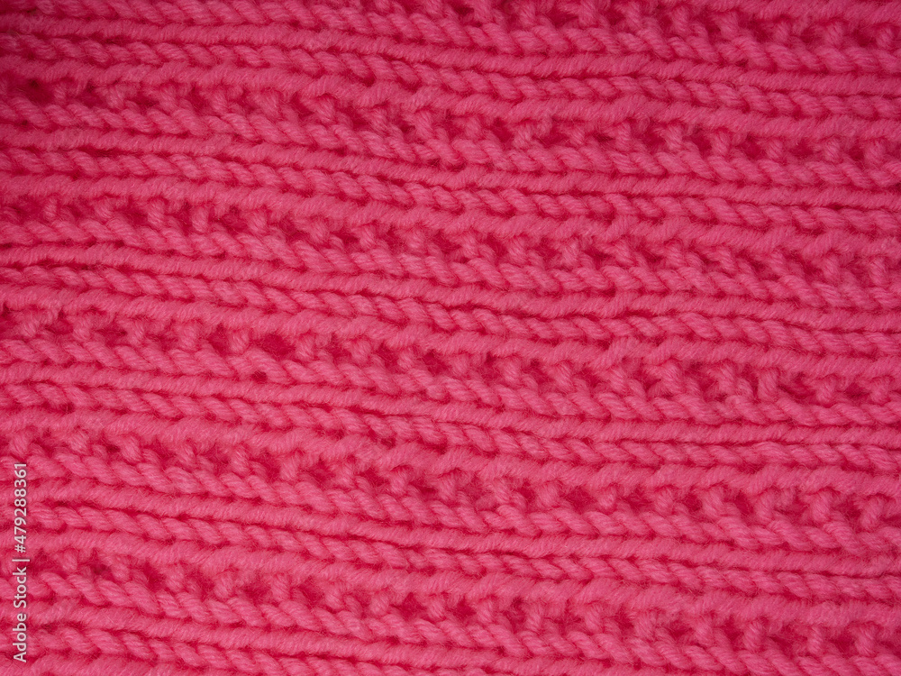 The texture of knitted fabric made of wool threads The texture of knitted fabric made of wool threads