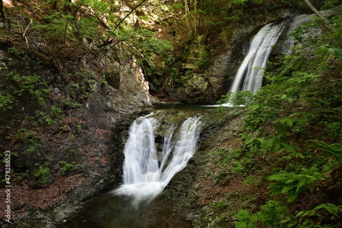Fototapeta Naklejka Na Ścianę i Meble -  two steps waterfall in summer