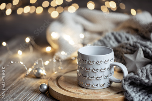 Beautiful Christmas cup on a blurred background with bokeh.