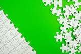 Conceptual photo of copyspace green background missing jigsaw puzzle. Image for motivation, inspiration and consultation, ideation concept