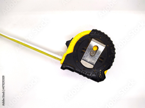 metric tape measure on white background. measuring tape photo.