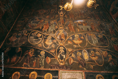 Church wall with paintings from the lives of the saints
