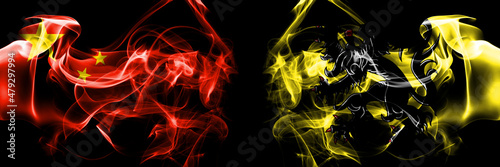 Flags of China, Chinese vs Flanders, Flemish. Smoke flag placed side by side on black background.