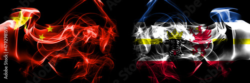 Flags of China, Chinese vs Germany, Mecklenburg Western Pomerania, state. Smoke flag placed side by side on black background. photo