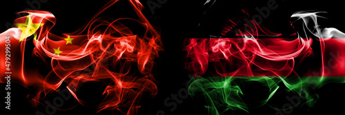 Flags of China, Chinese vs Malawi. Smoke flag placed side by side on black background.