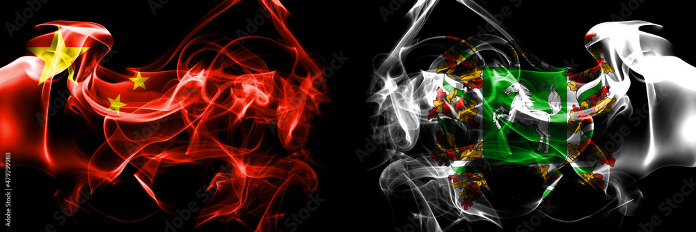 Fototapeta premium Flags of China, Chinese vs Russia, Russian, Tomsk Oblast. Smoke flag placed side by side on black background.
