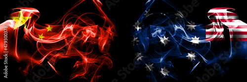 Flags of China, Chinese vs United States of America, America, US, USA, American, Easton, Pennsylvania. Smoke flag placed side by side on black background. photo