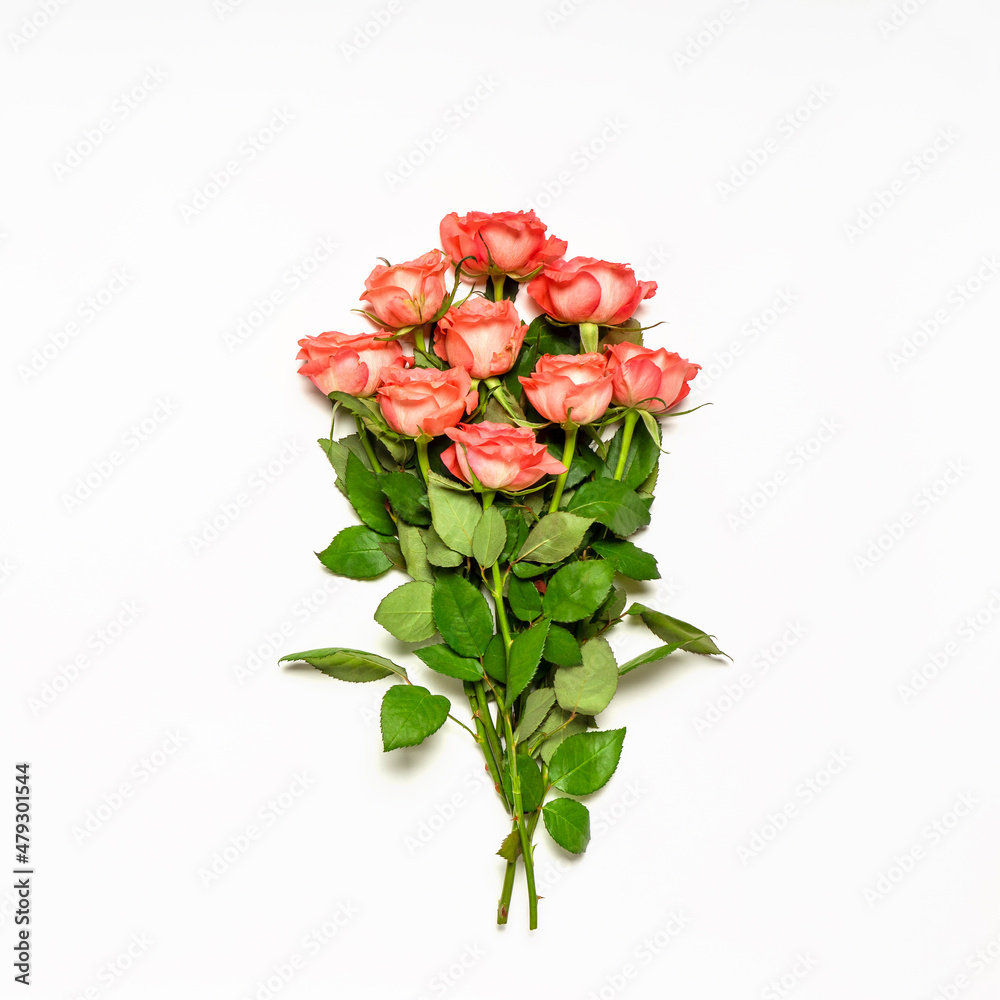 Bouquet of fresh pink roses on white background. Beautiful floral greeting card for Valentine's, women's or mother's day. Flat lay, top view