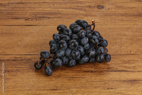 Purple grape branch over background