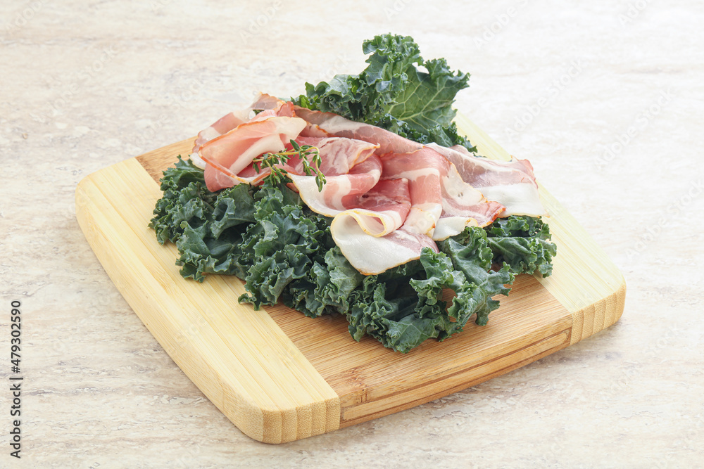Raw pork bacon over board Raw pork bacon over board