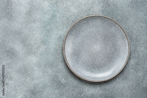 Schilderij op canvas Empty gray plate on gray rustic concrete background