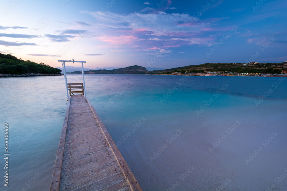 pier at the sea during dusk in Ksamil in Albania