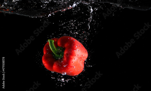 Colorful freshness fruit falling in to water splash and black background