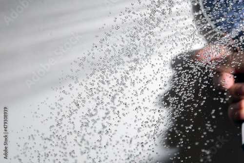 Splahing water and shower head. photo