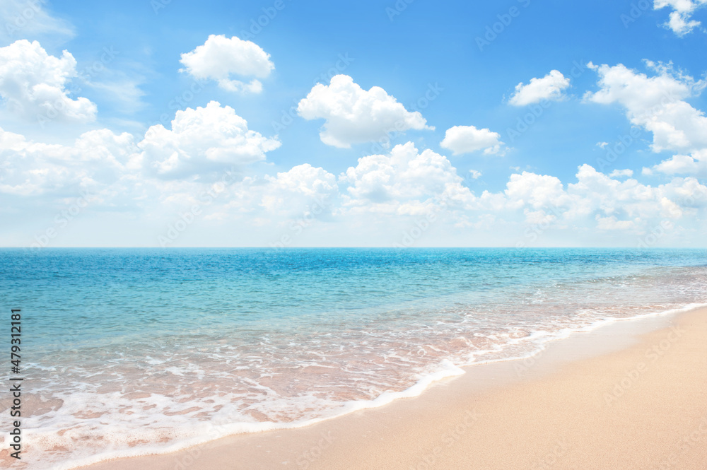 Beautiful Sandy Beach with blue ocean againt blue sky soft cloud , summer background