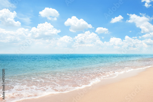 Beautiful Sandy Beach with blue ocean againt blue sky soft cloud   summer background